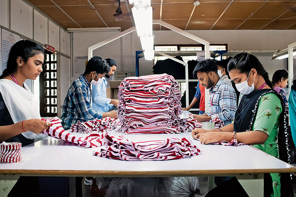 | Photo: Subash Sagar : At Work: Employees at a textile unit in Pooluvanpatti, Tiruppur, sorting stitched garments before they are sent for packaging and export