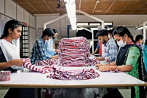 | Photo: Subash Sagar : At Work: Employees at a textile unit in Pooluvanpatti, Tiruppur, sorting stitched garments before they are sent for packaging and export
