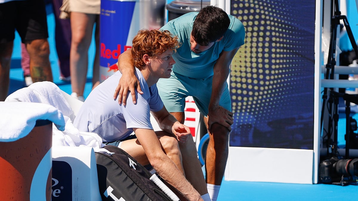 Carlos Alcaraz consoles Jannik Sinner after the Italian was forced to retire from the Cincinnati Open final due to illness.