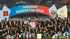 NorthEast United FC's players pose with the trophy after winning the Durand Cup 2025 in Kolkata. - PTI