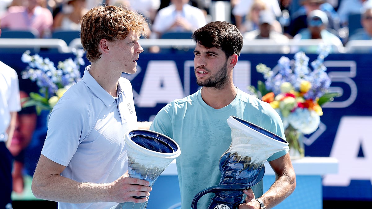 Jannik Sinner and Carlos Alcaraz pictured after the former retired from the Cincinnati Open final