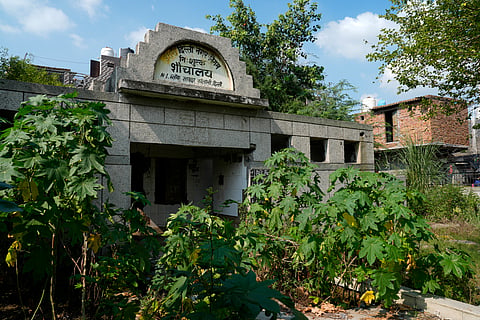 A broken community toilet in the Savda Ghevra JJ colony. 