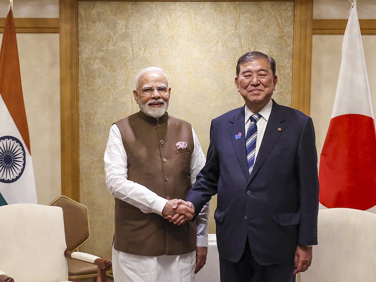 In this image posted on Aug. 29, 2025, Prime Minister Narendra Modi with his Japanese counterpart Shigeru Ishiba during the India-Japan Economic Forum, in Tokyo, Japan. (@MEAIndia/X via PTI Photo) - -