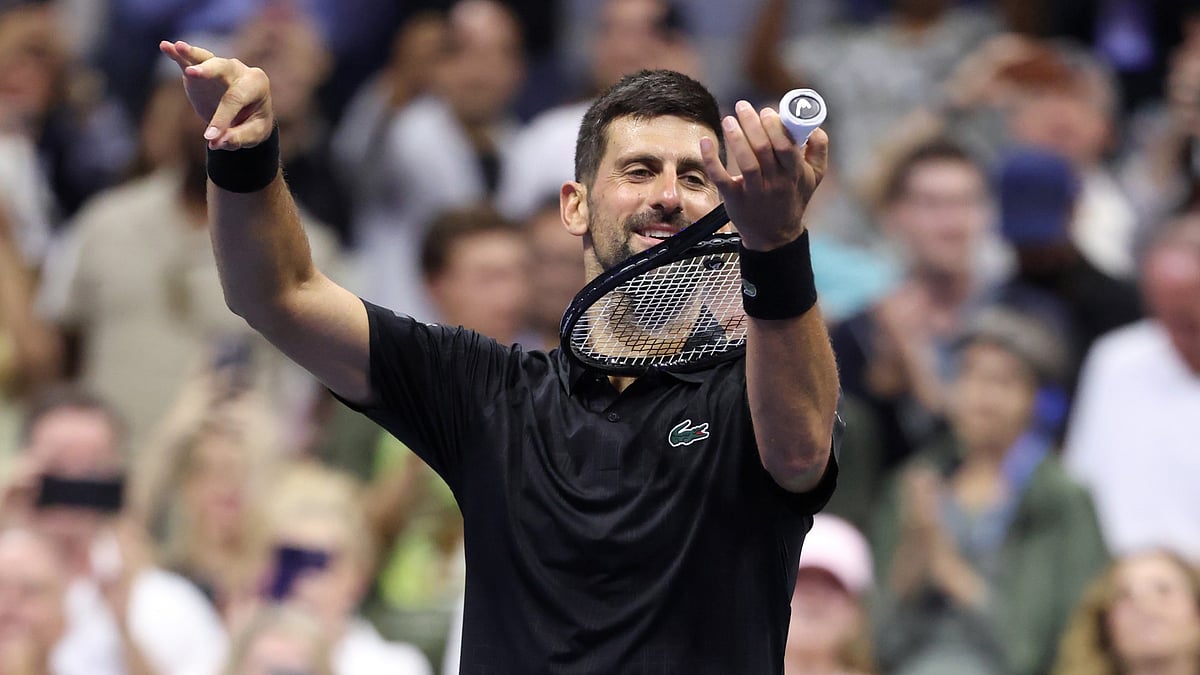 Novak Djokovic celebrates after his US Open 2025 third round win over Cameron Norrie.