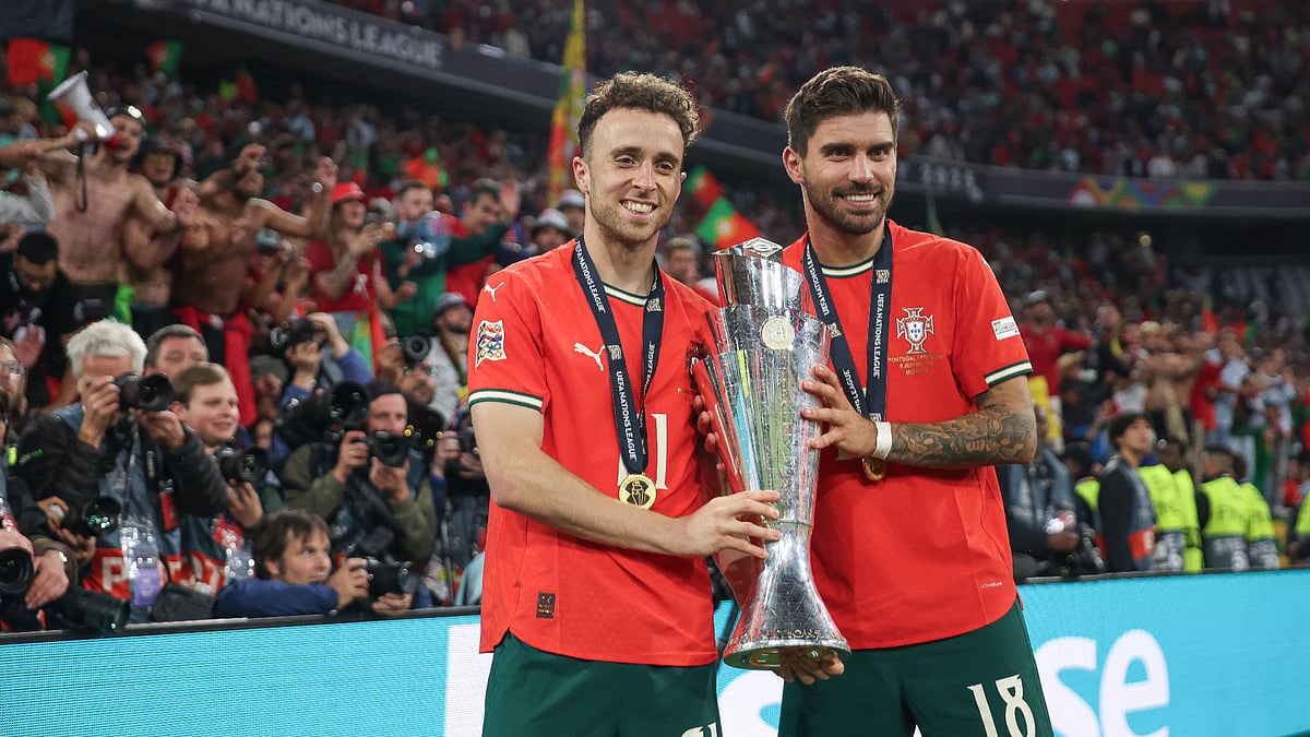 Diogo Jota and Ruben Neves hold the Nations League trophy after Portugal's victory in June