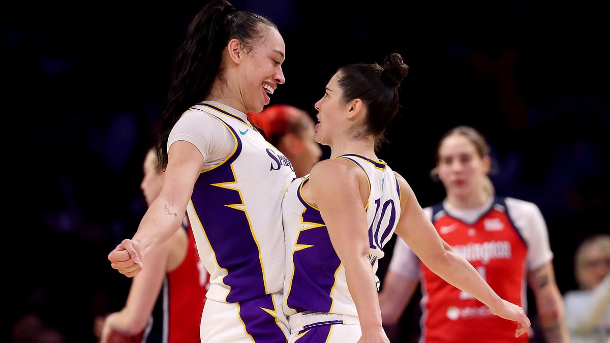 Dearica Hamby #5 and Kelsey Plum #10 of the Los Angeles Sparks celebrate a basket and a foul during the fourth quarter against the Washington Mystics at Crypto.com Arena on August 31, 2025 in Los Angeles, California.