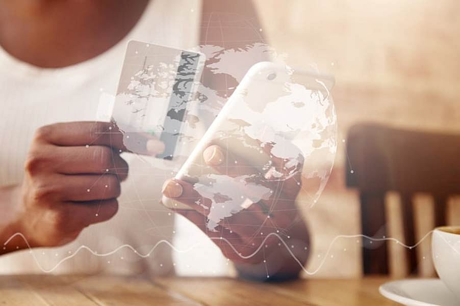 Hand holding card with world map