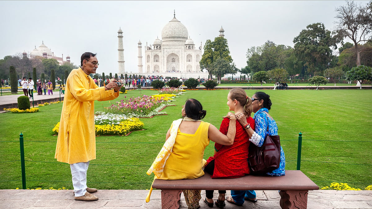 | Shutterstock | : Tourists at Taj Mahal