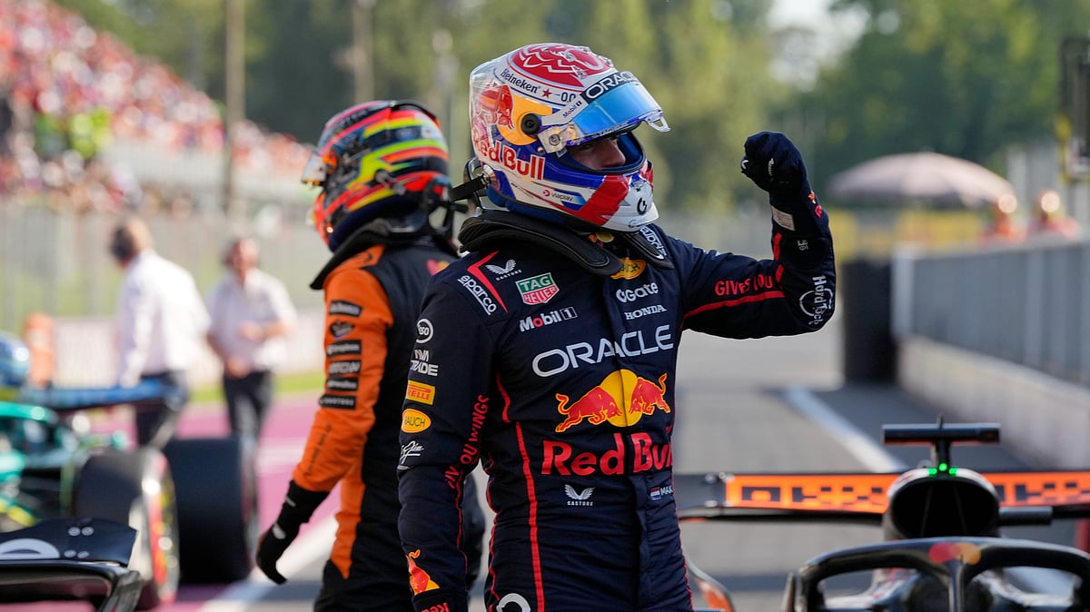 (AP Photo/Luca Bruno) : Red Bull driver Max Verstappen of the Netherlands celebrates his pole position after the qualifying session ahead of the Italian Grand Prix at the Monza racetrack in Monza, Italy, Saturday, Sept. 6, 2025.
