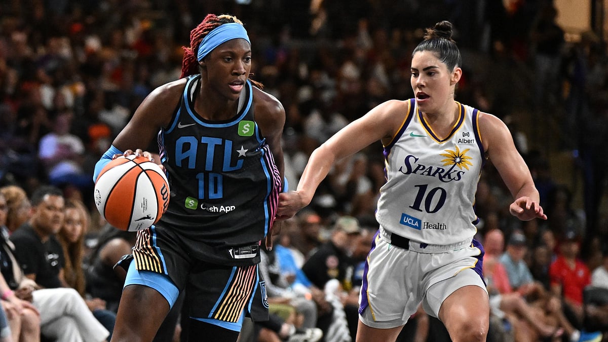 Rhyne Howard #10 of the Atlanta Dream handles the ball as Kelsey Plum #10 of the Los Angeles Sparks play defense during third quarter at Gateway Center Arena on September 5, 2025 in College Park, Georgia.
