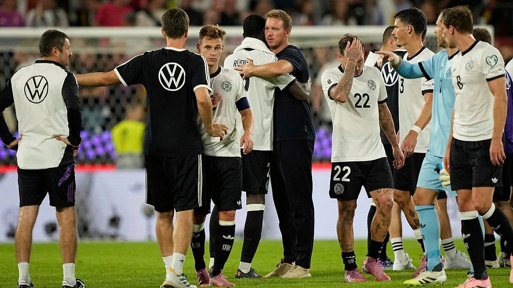 Photo: AP : Germany Vs Northern Ireland Highlights, FIFA World Cup European Qualifiers: Julian Nagelsmann, centre, celebrates with the players after the hosts' win in Cologne.
