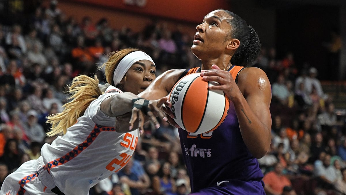 Aneesah Morrow #24 of the Connecticut Sun fouls Alyssa Thomas #25 of the Phoenix Mercury on a drive to the basket in the first half at Mohegan Sun Arena on September 6, 2025 in Uncasville, Connecticut.