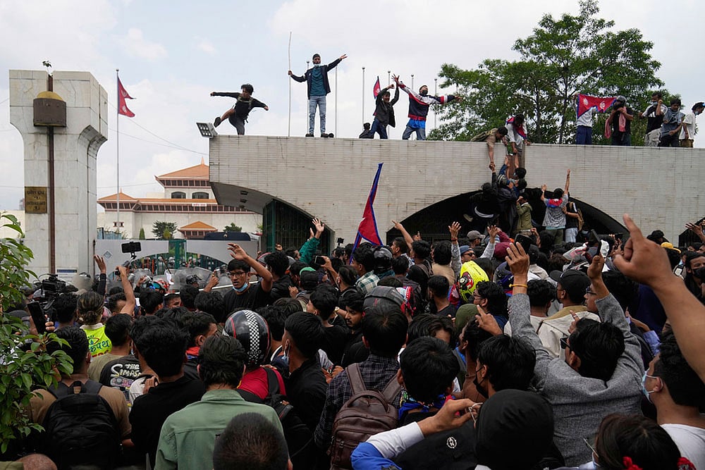 Photo: AP/Niranjan Shrestha : Dozens of police stations were vandalised and damaged, though the exact number is yet to be confirmed.