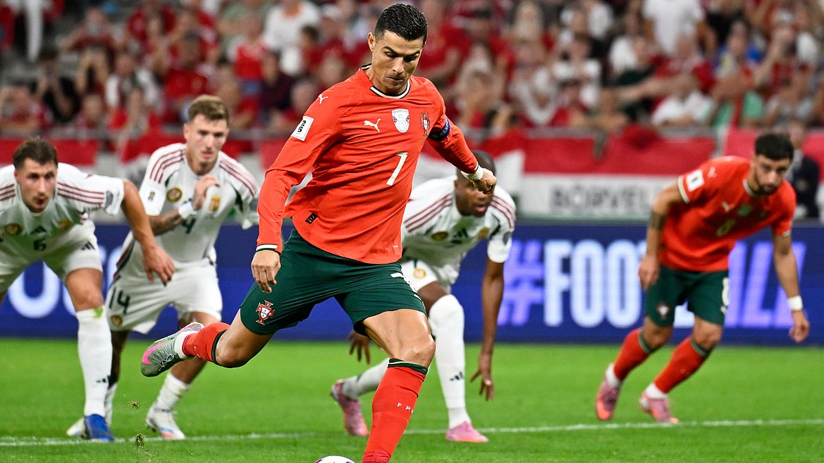 | Photo: AP/Denes Erdos : Portugal's Cristiano Ronaldo scores his side's second goal from the penalty spot during a World Cup 2026 group F qualifying soccer match between Hungary and Portugal at the Puskas Arena in Budapest, Tuesday, Sept. 9, 2025. 