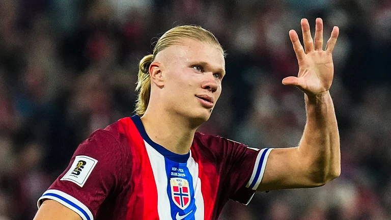 Erling Haaland celebrates after scoring five goals against Moldova. - null