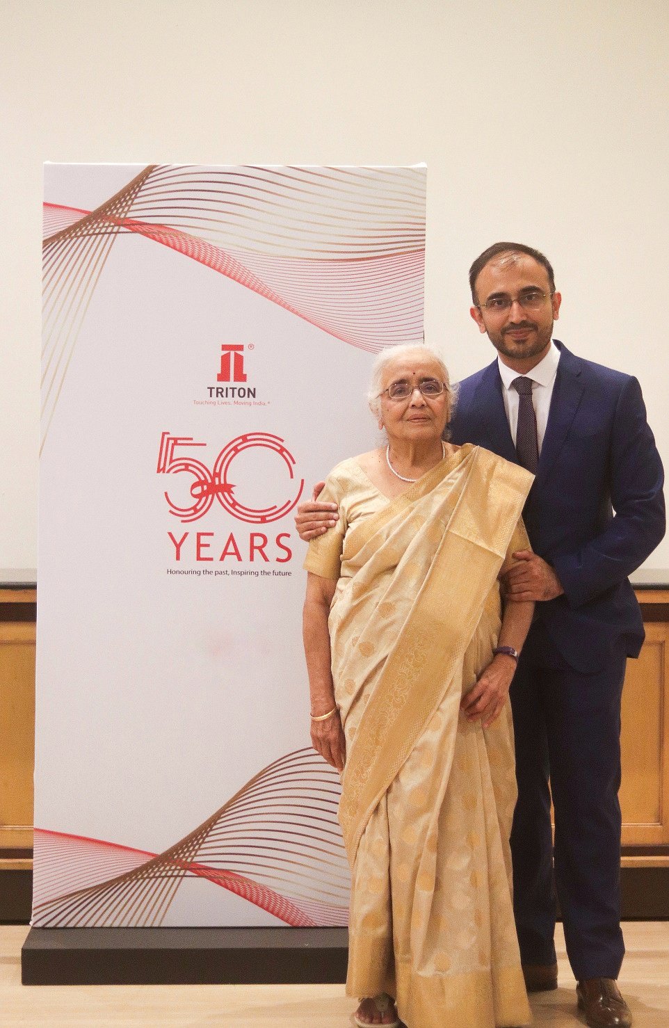 Anuradha M. Gokarn & Aditya M. Gokarn standing together 
