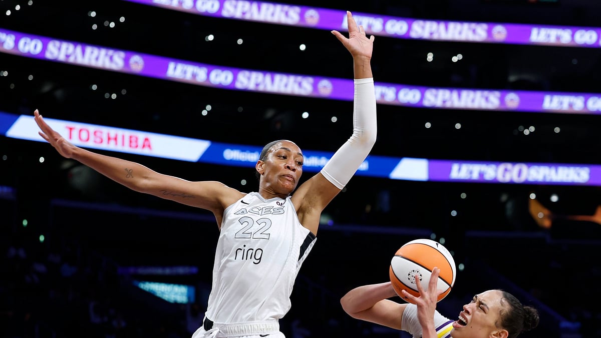 Dearica Hamby #5 of the Los Angeles Sparks reacts as she is fouled by A'ja Wilson #22 of the Las Vegas Aces during the first half in the game between the Las Vegas Aces and the Los Angeles Sparks at Crypto.com Arena on September 11, 2025 in Los Angeles, California.