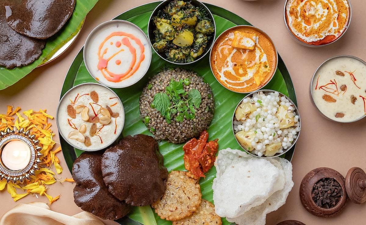 A Navratri Thali featuring various fasting dishes like sabudana khichdi, kheer arranged on a plate.