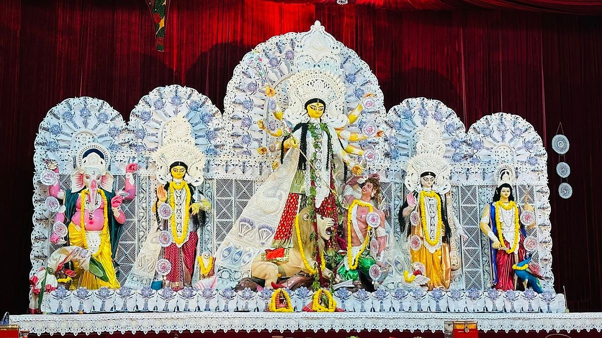 Durga Puja pandal with elaborate deity idols.