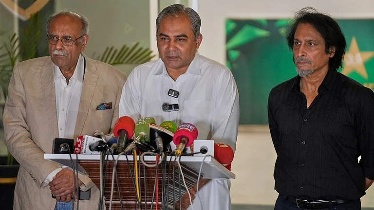 Pakistan's interior minister and chairman of Pakistan Cricket Board, Mohsin Naqvi, centre, speaks as former PCB heads Najam Sethi, left, and Ramiz Raja watch during a press conference regarding the Asia Cup cricket tournament, in Lahore. - AP