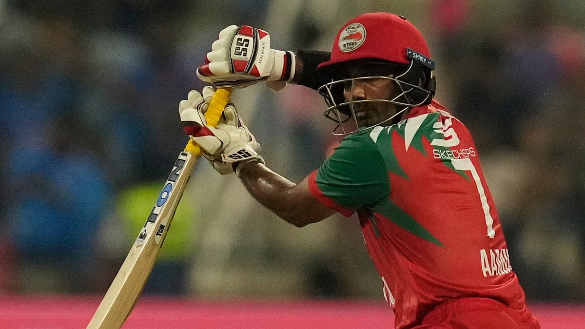 (AP Photo/Altaf Qadri) : Oman's Aamir Kaleem plays a shot during the Asia Cup cricket match between India and Oman at Zayed Cricket Stadium in Abu Dhabi, United Arab Emirates, Friday, Sept. 19, 2025.