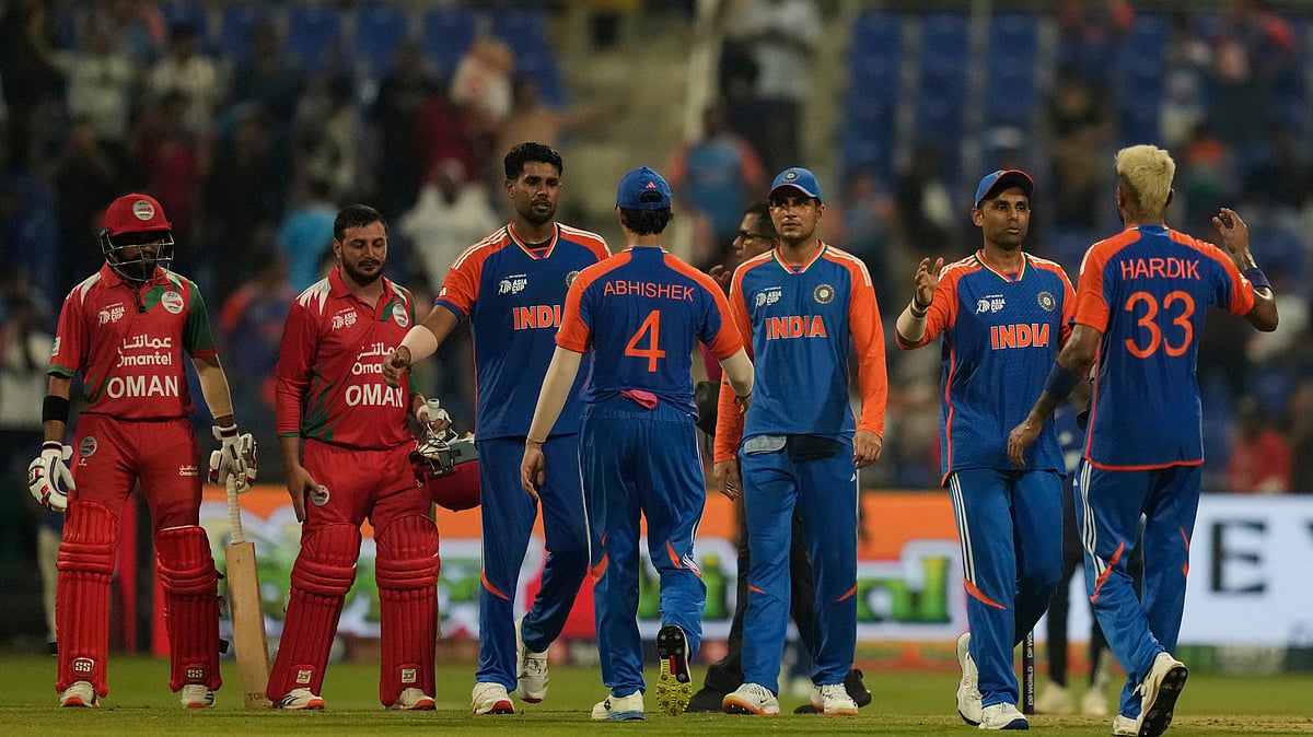 (AP Photo/Altaf Qadri) : India's players celebrate their team's victory during the Asia Cup cricket match against Oman at Zayed Cricket Stadium in Abu Dhabi, United Arab Emirates, Friday, Sept. 19, 2025.