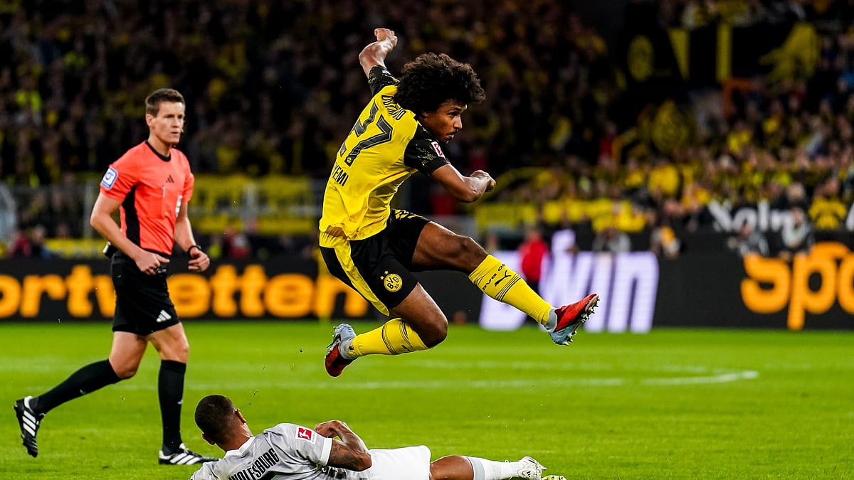 Borussia Dortmund's Karim Adeyemi scores against Wolfsburg.