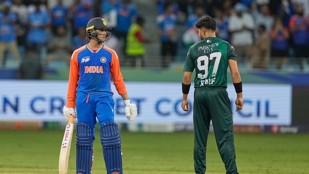 AP/Altaf Qadri : India's Abhishek Sharma talks to Pakistan's Haris Rauf during the Asia Cup
