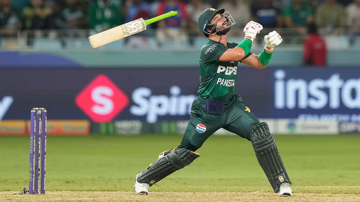 | Photo: AP/Altaf Qadri     : Pakistan's Sahibzada Farhan looses grip on his bat while playing a shot during the Asia Cup cricket match between India and Pakistan at Dubai International Cricket Stadium in Dubai, United Arab Emirates, Sunday, Sept. 21, 2025.