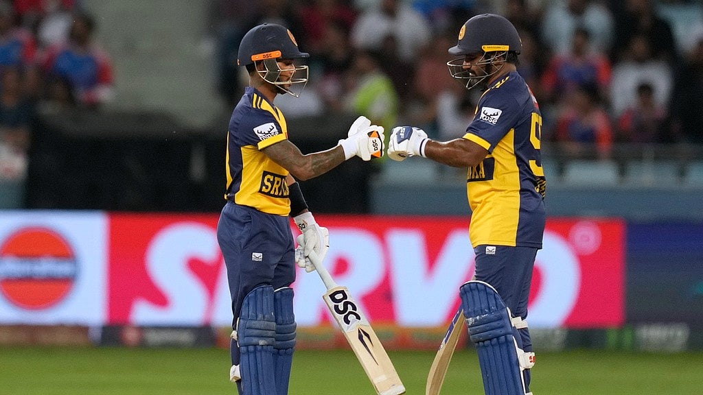 AP : Pathum Nissanka, left, and batting partner Kusal Perera touch gloves during the Asia Cup match between India and Sri Lanka at Dubai International Cricket Stadium.