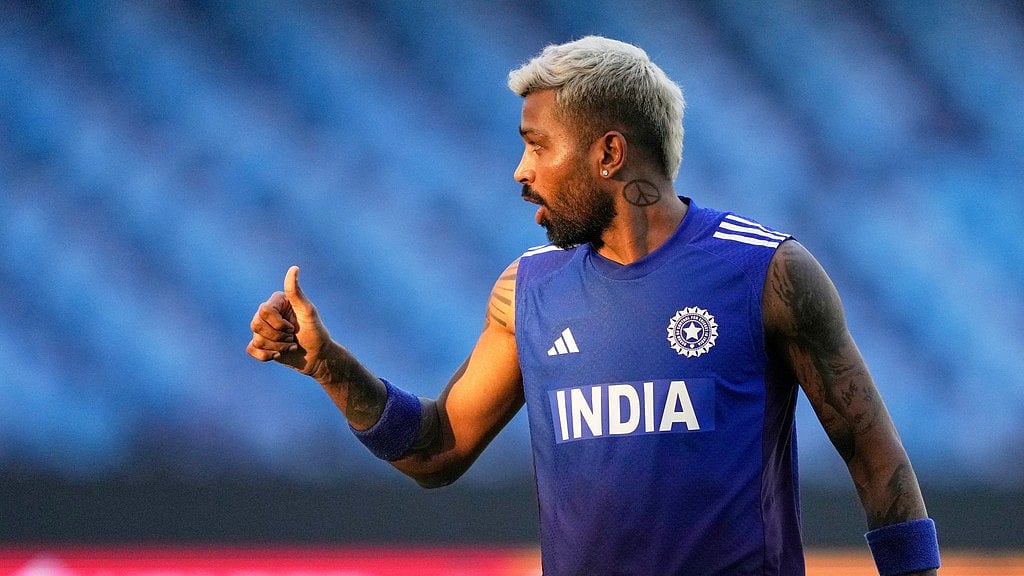 AP/Altaf Qadri : India's Hardik Pandya warms up