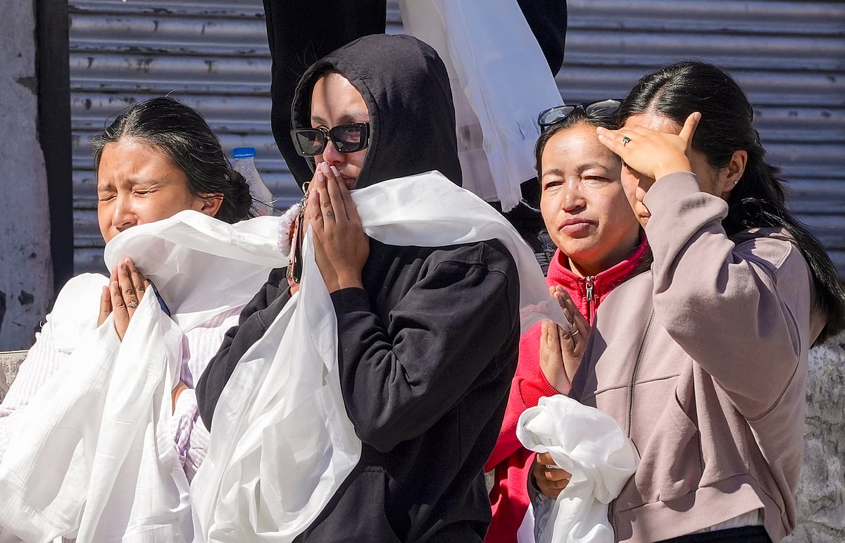 S Irfan : People pay their respects to 24-year-old Stanzin Namgyal, who was killed in violence during recent protests for Ladakh statehood, as his mortal remains are being taken for last rites amid curfew, in Leh, Sunday, Sept. 28, 2025. 