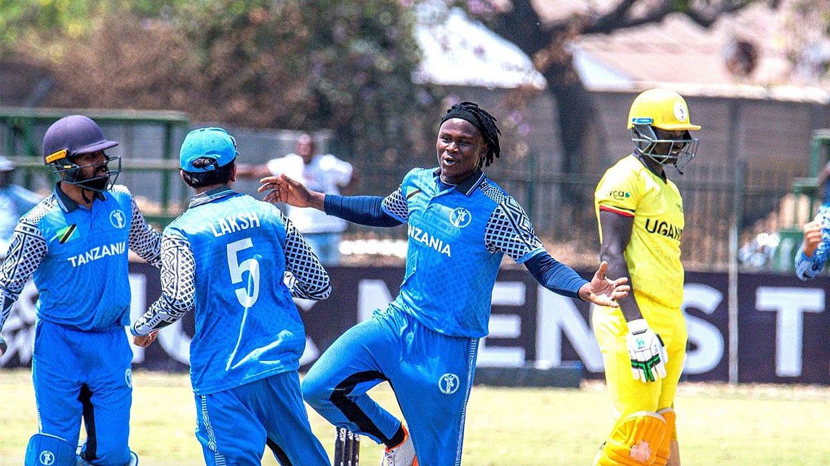 X/Zimbabwe Cricket : Tanzania players celebrate a Uganda wicket in Harare.