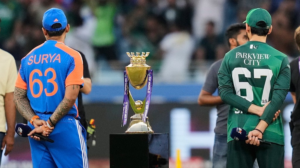AP/Altaf Qadri : India's captain Suryakumar Yadav, left, and Pakistan's skipper Salman Agha wait for the coin toss of the Asia Cup final.