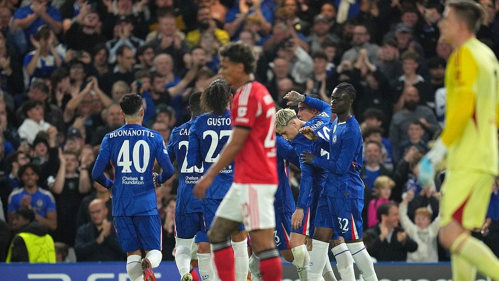 Photo: AP : UEFA Champions League Matchday 2 Highlights: Chelsea players celebrate after Benfica's Richard Rios, foreground centre, scored an own goal in London.