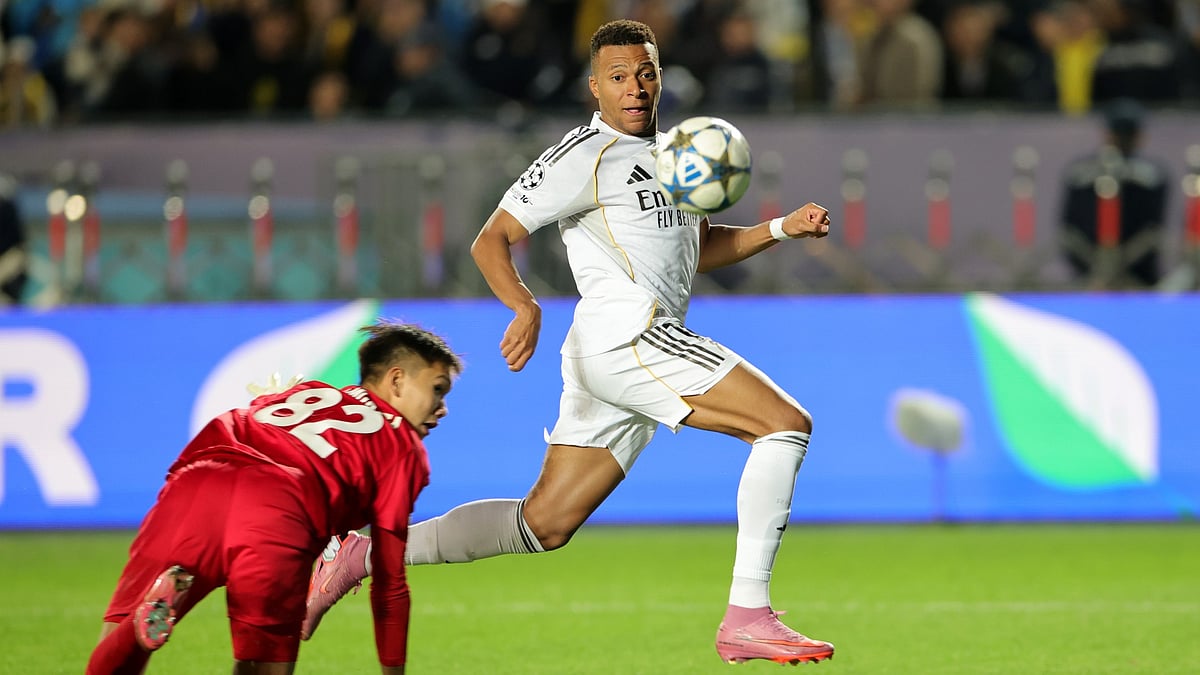Kylian Mbappe scores his second goal against Kairat Almaty.