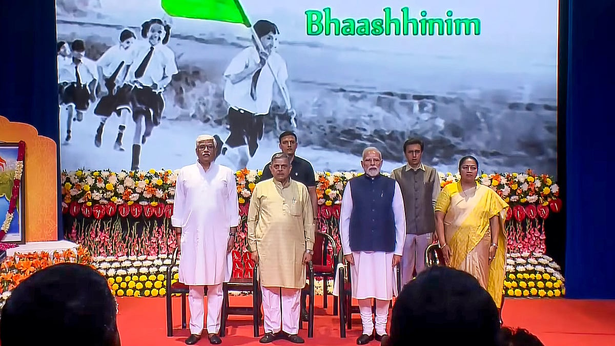 (@NarendraModi/YT via PTI Photo) : In this screengrab, PM Narendra Modi, RSS Sarkaryavah Dattatreya Hosabale, Delhi CM Rekha Gupta and others are seen at the RSS centenary celebrations at Dr Ambedkar International Centre, New Delhi.