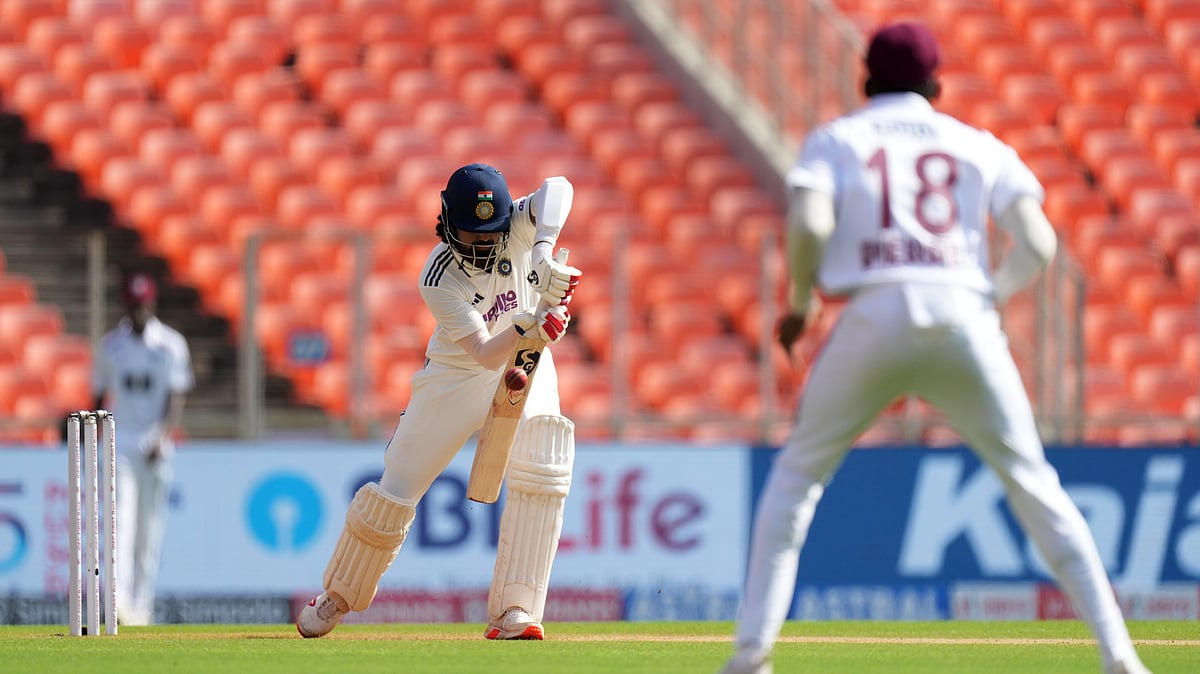 (AP Photo/Ajit Solanki) : India's KL Rahul, left, plays a shot on the second day of the first Test cricket match between India and West Indies at Narendra Modi Stadium in Ahmedabad, India, Friday, Oct. 3, 2025.