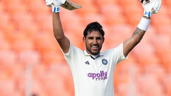 | Photo: AP/Ajit Solanki : File photo of India's Dhruv Jurel celebrating after scoring a century on the second day of the first Test cricket match between India and West Indies at Narendra Modi Stadium.