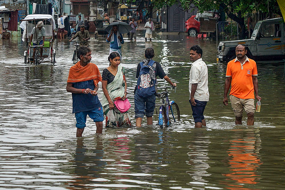 | Photo: PTI : Weather: Rain in Varanasi