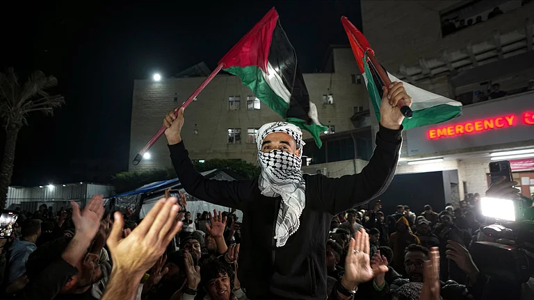 Palestinians celebrate the announcement of a ceasefire deal between Hamas and Israel (REPRESENTATIONAL IMAGE) - AP photo