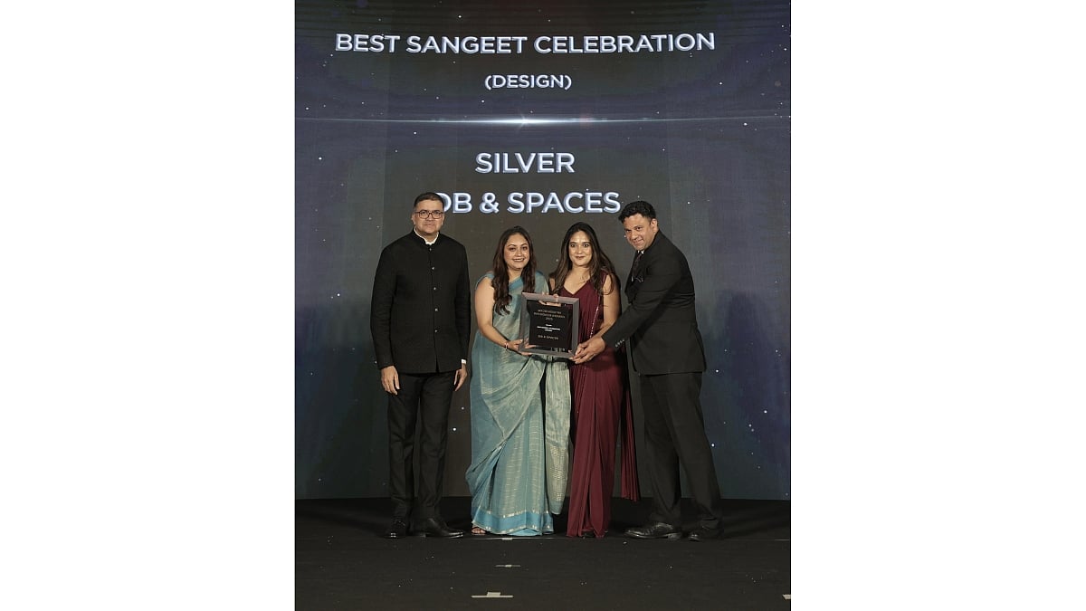 Dakshita Bhatla recieving the Silver award for Best Sangeet Celebration (Design) on stage.