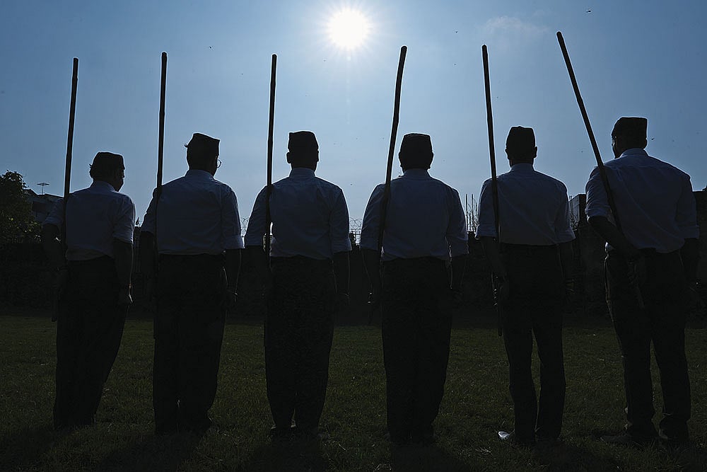 | Photo: Tribhuvan Tiwari : Propaganda Units: RSS members at a shakha in Valmiki Colony, New Delhi, on October 2, 2025