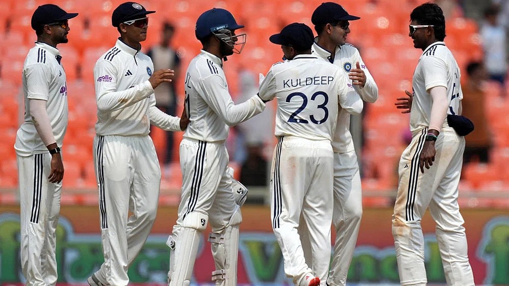 | Photo: AP/Ajit Solanki : India Vs West Indies, 1st Test: IND players celebrate a wicket.