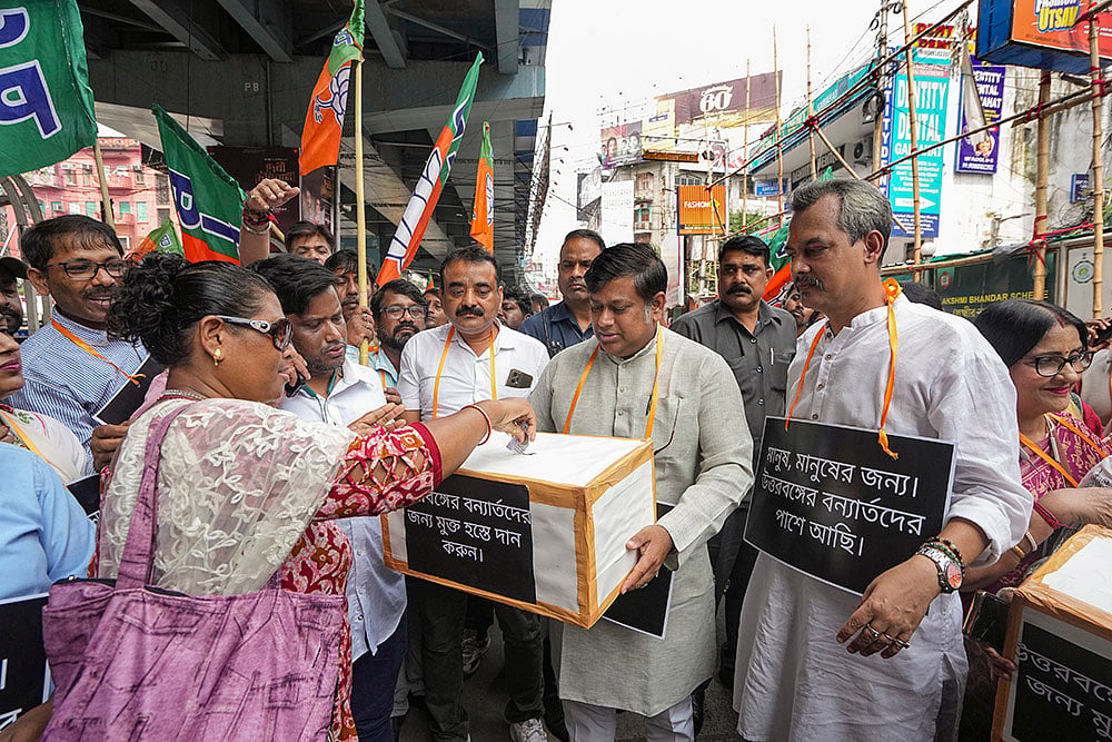 BJP activists collect flood relief funds for North Bengal victims