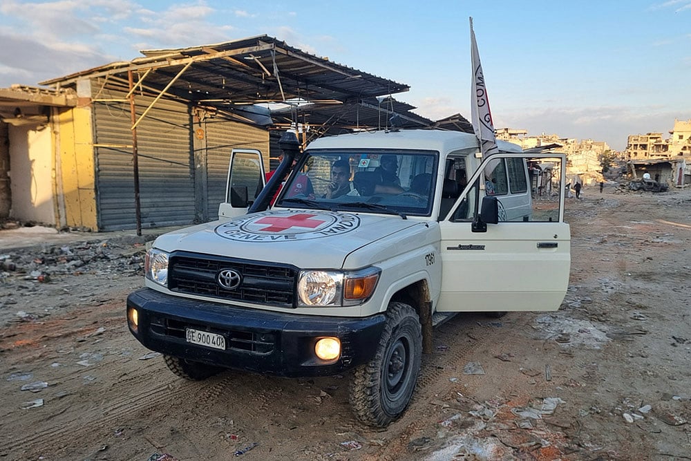 Israel Hamas Gaza war- Hostage release _A Red Cross vehicle