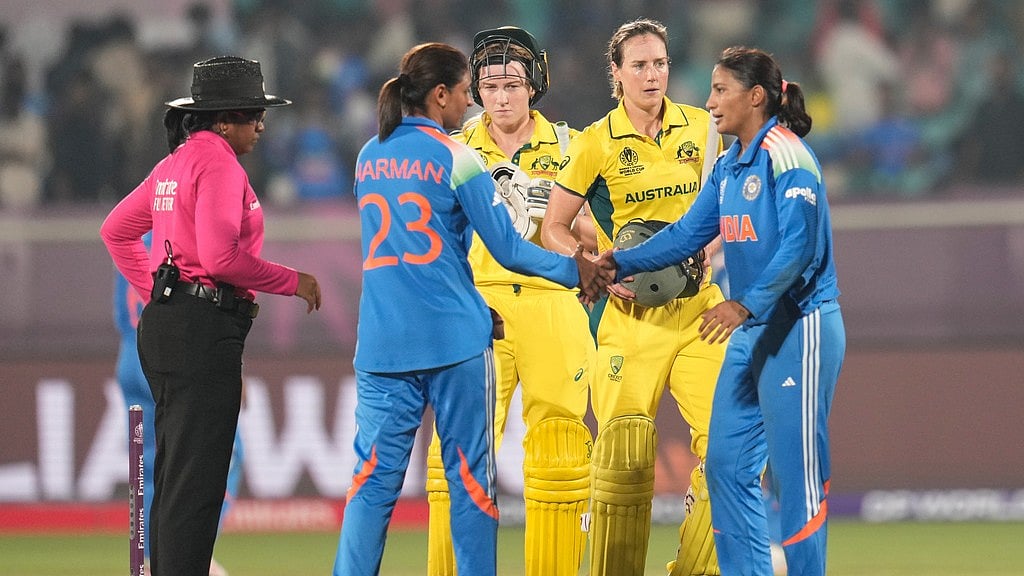 AP : Players of the two teams greet each other at the end of the ICC Women's Cricket World Cup match between India and Australia at ACA-VDCA Cricket Stadium in Visakhapatnam.