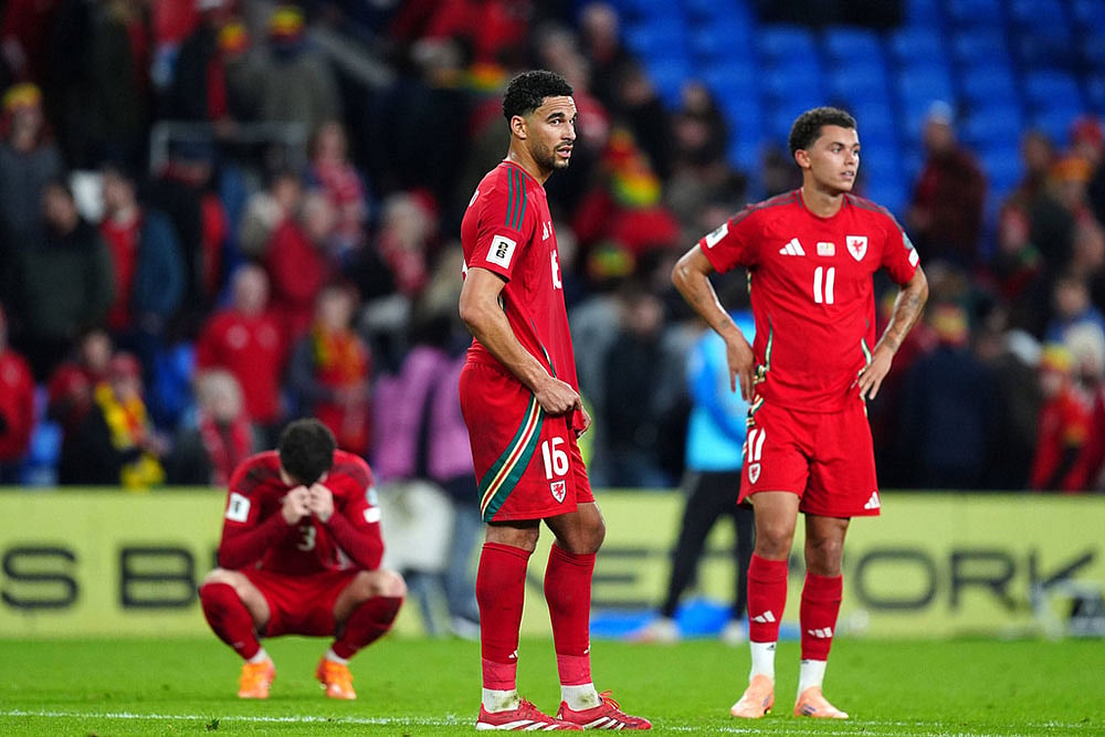 | Photo: David Davies/PA via AP : World Cup Qualifier Soccer Match: Wales vs Belgium