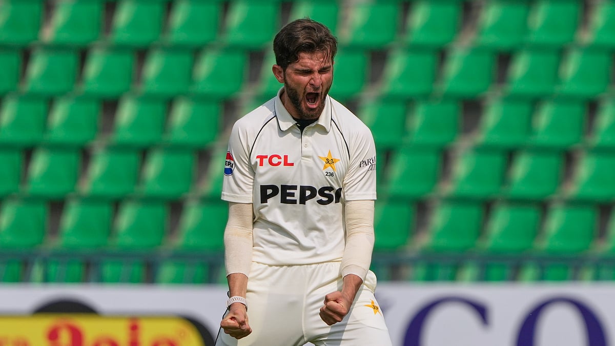 (AP Photo/K.M. Chaudary) : Pakistan's Shaheen Shah Afridi celebrates after taking the wicket of South Africa's Kyle Verreynne during the fourth day of the first test cricket match between Pakistan and South Africa, in Lahore, Pakistan, Wednesday, Oct. 15, 2025.