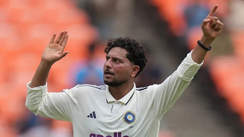Indias Kuldeep Yadav celebrates the dismissal of West Indies Shai Hope
